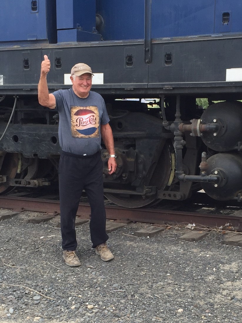 Former Port Commissioner Frank Mianecki gives a thumbs up for the first locomotive to arrive in Royal in over 25 years. Frank worked many, many hours removing rock slides and debris to open up the line from Othello to Royal to rail traffic. He is greatly missed.